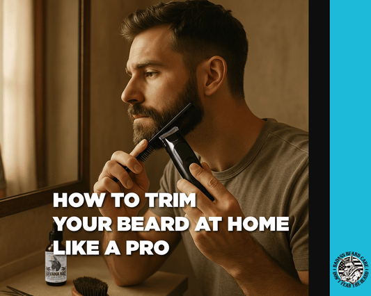 man trimming his short beard with a beard trimmer and comb