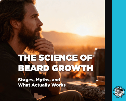 Side profile, bearded rugged man, sitting a log scratching his chin as sun rises over mountains in the background