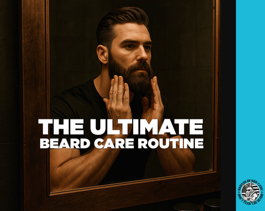 The Ultimate Beard Care Routine - Man Standing In Front Of Mirror Applying Beard Oil